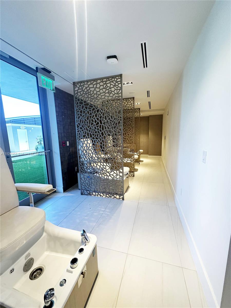 3100 North Ocean Drive, Unit 1206 Singer Island, FL 33404 - Photo 32 of 40 a living room with furniture and a fireplace