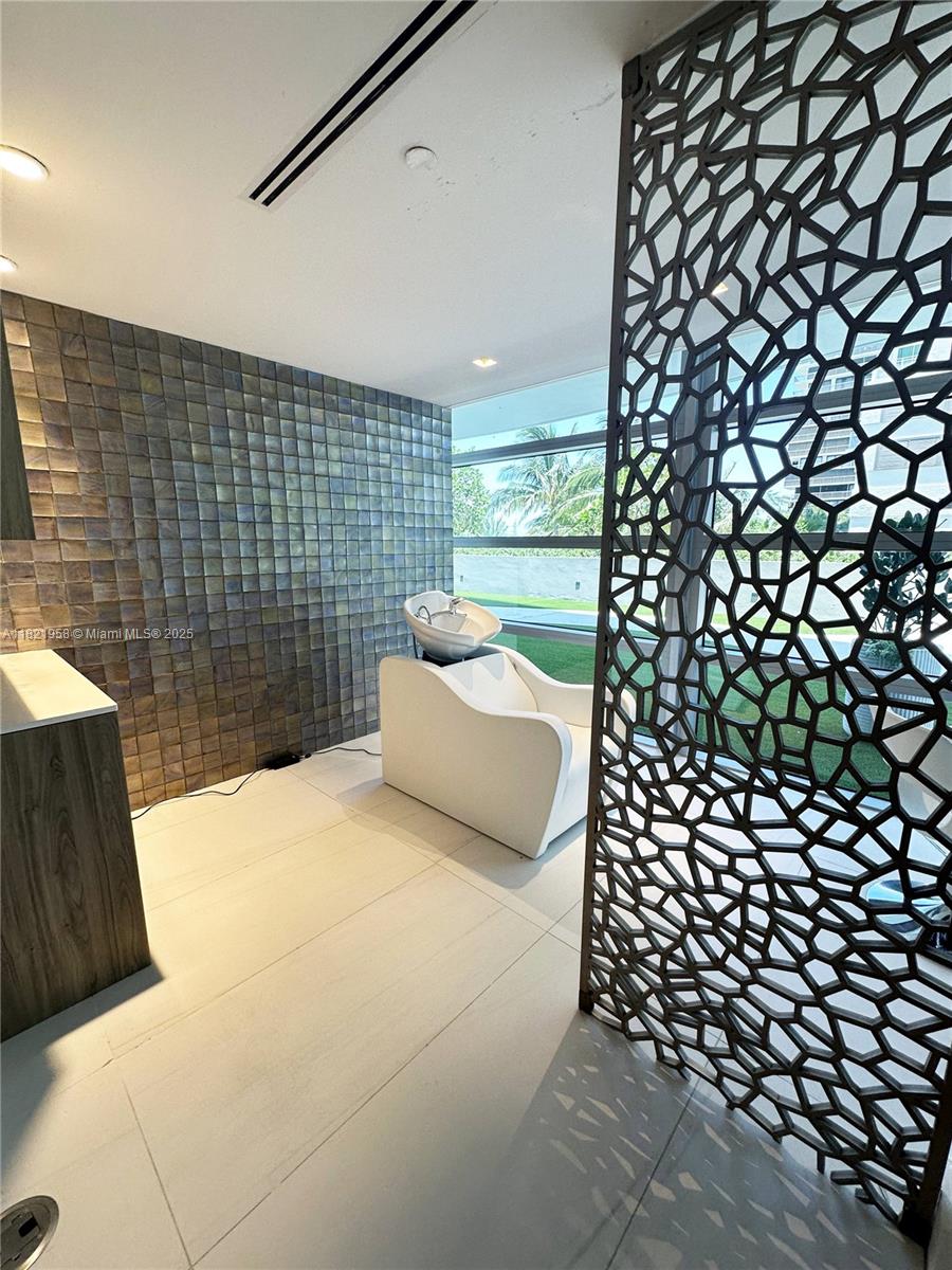 3100 North Ocean Drive, Unit 1206 Singer Island, FL 33404 - Photo 33 of 40 a bedroom with a bed and a wall painting