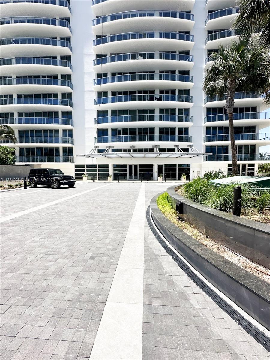 3100 North Ocean Drive, Unit 1206 Singer Island, FL 33404 - Photo 34 of 40 a swimming pool with buildings in front of it