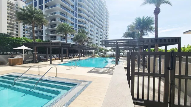 a view of swimming pool with a yard