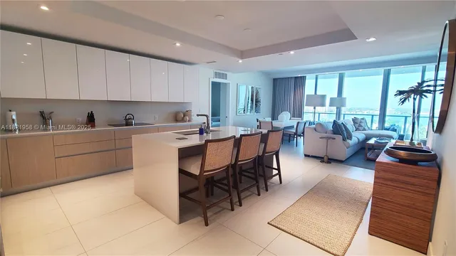 a living room with furniture a window and a sink