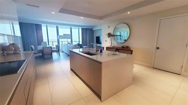 a very nice looking kitchen with a large window