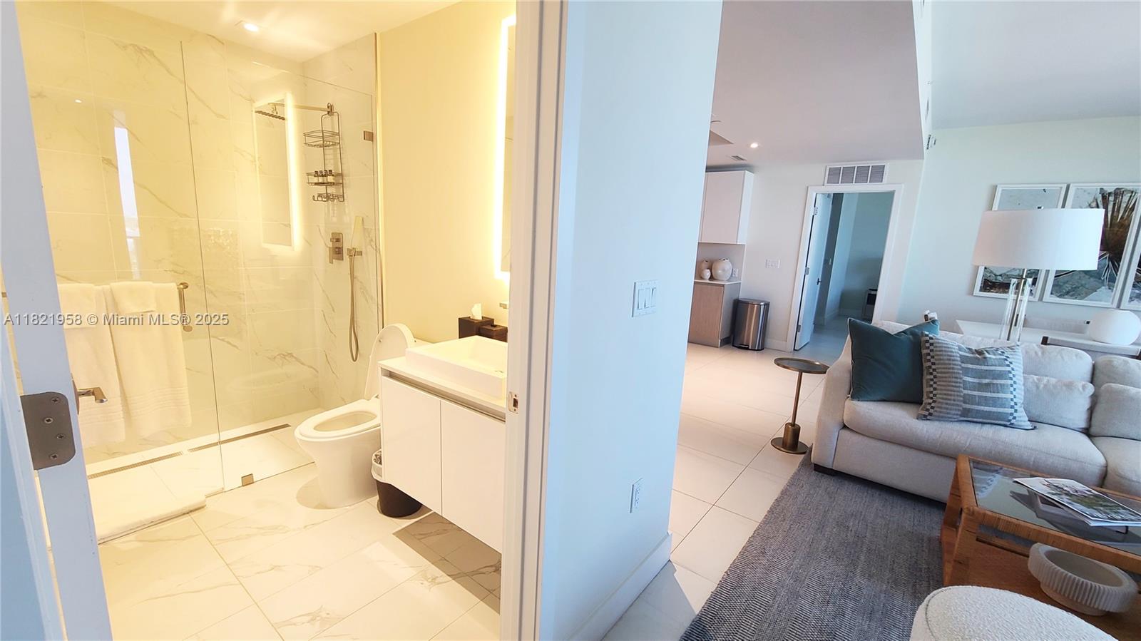 3100 North Ocean Drive, Unit 1206 Singer Island, FL 33404 - Photo 9 of 40 a bathroom with a tub shower and a sink