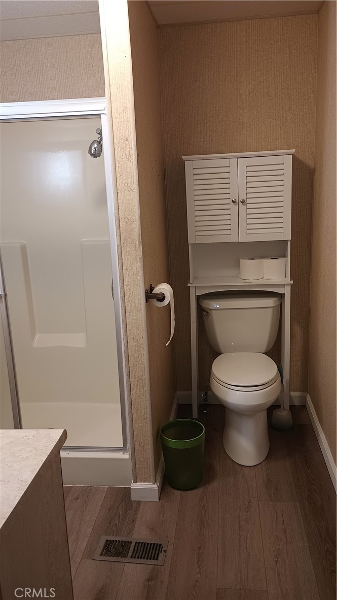 17800 Langlois Road Desert Hot Springs, CA 92241 - Photo 11 of 19 a bathroom with a toilet and a shower