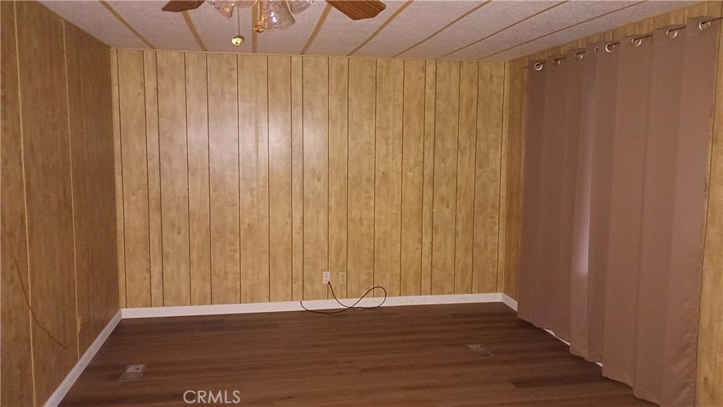 17800 Langlois Road Desert Hot Springs, CA 92241 - Photo 8 of 19 a view of a room with wooden walls
