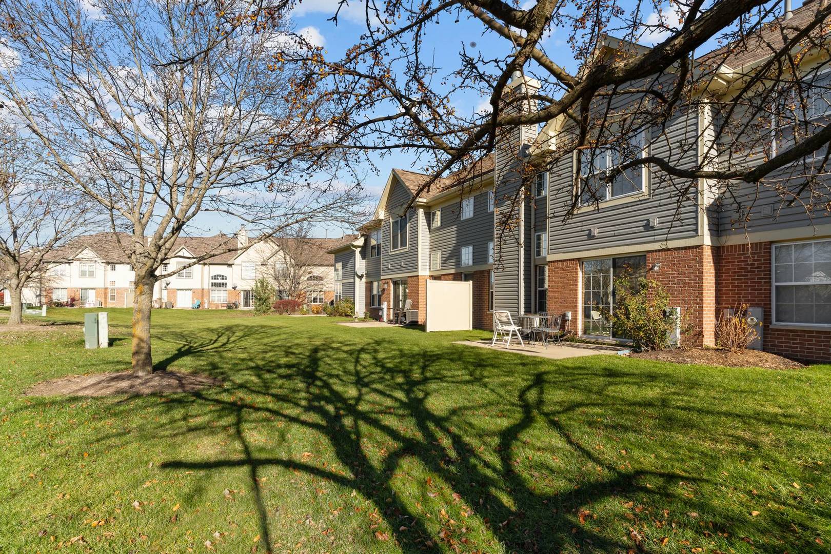 232 Manor Drive Buffalo Grove, IL 60089 - Photo 19 of 21 a view of a house with a yard