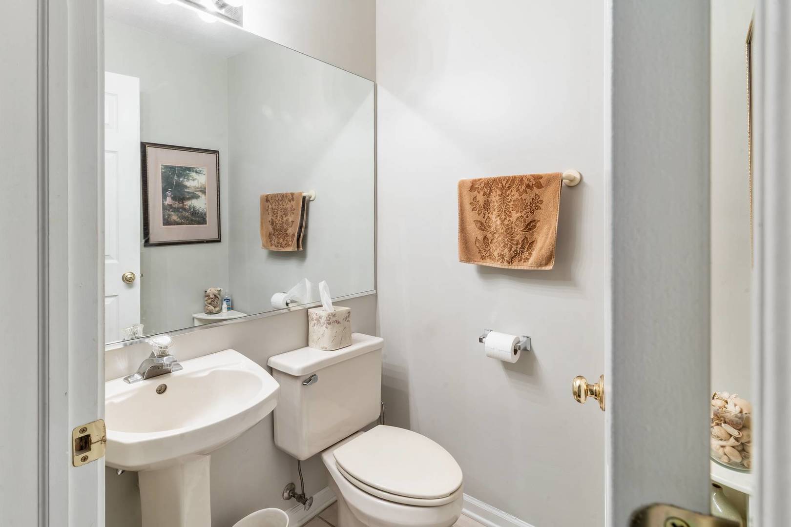 232 Manor Drive Buffalo Grove, IL 60089 - Photo 9 of 21 a bathroom with a toilet a sink and mirror
