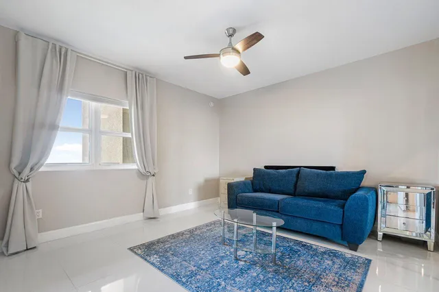 a living room with furniture and a rug