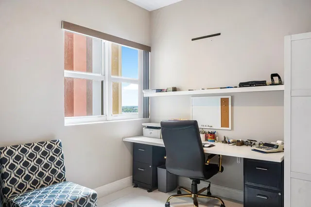 a workspace with furniture and window