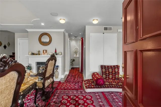 a view of a hallway with dining area closet and wooden floor