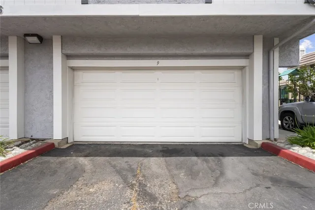a kitchen with granite countertop a sink stainless steel appliances and cabinets