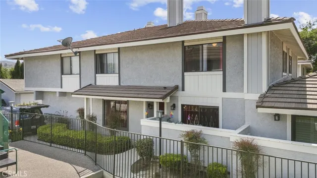 a front view of a house with a porch