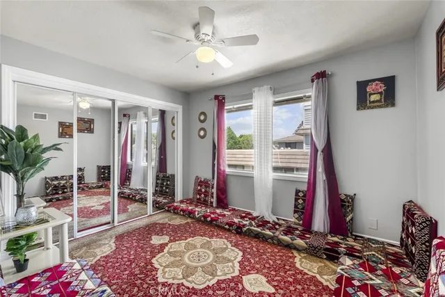 a bedroom with furniture and a chandelier