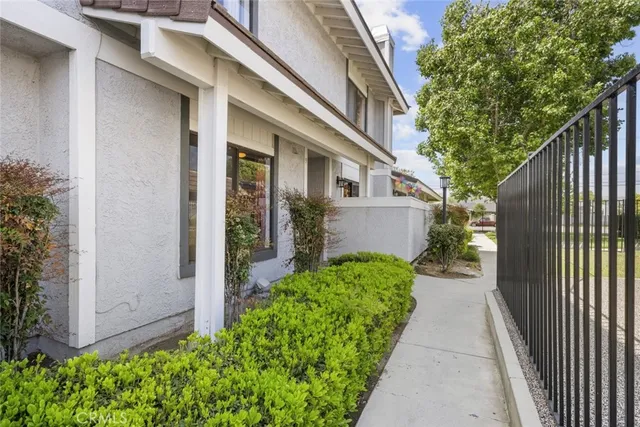 a view of a pathway along the house