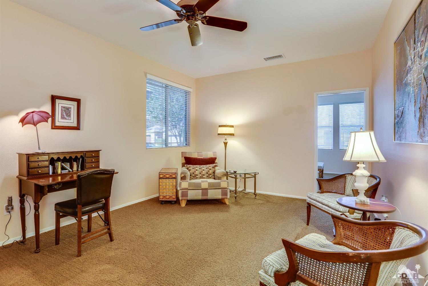 83313 Lone Star Road Indio, CA 92203 - Photo 15 of 23 a living room with furniture and a wooden floor