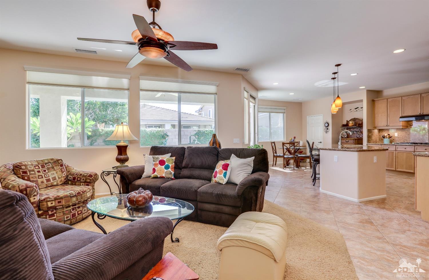 83313 Lone Star Road Indio, CA 92203 - Photo 4 of 23 a living room with furniture kitchen view and a large window