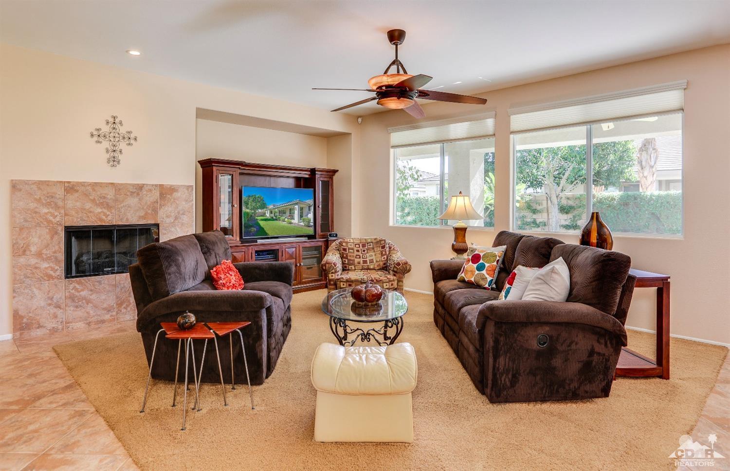 83313 Lone Star Road Indio, CA 92203 - Photo 8 of 23 a living room with furniture and a fireplace