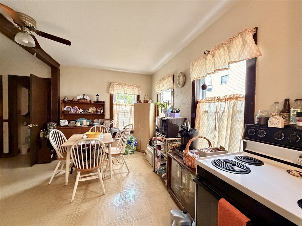 12 Whitcomb Street Webster, MA 01570 - Photo 32 of 40 a view of a workspace with furniture and a window