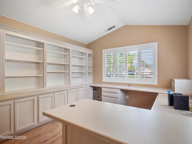 a view of kitchen with furniture and wooden floor