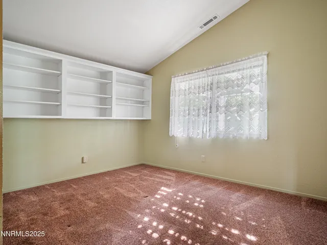 a view of a big room with windows and natural light