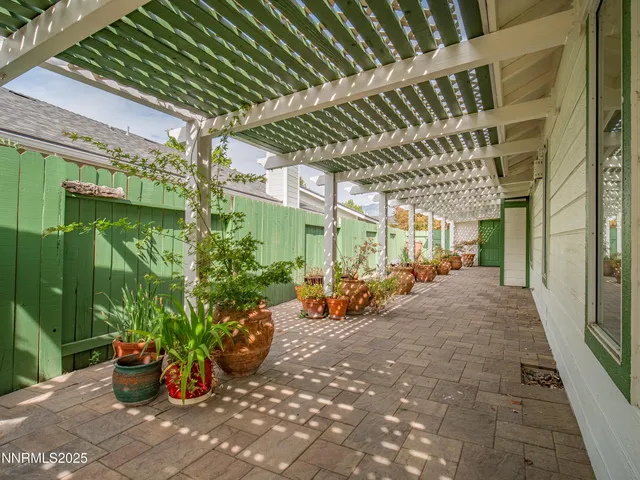 a view of a house with backyard porch and sitting area