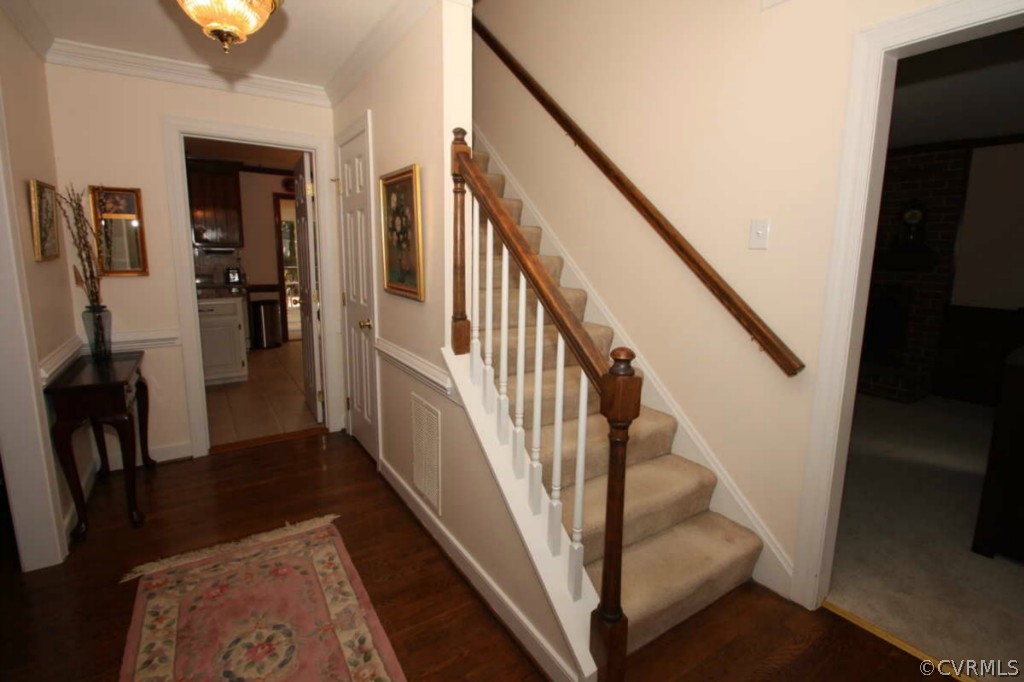 2141 Corner Rock Road Midlothian, VA 23113 - Photo 14 of 22 a view of staircase with lots of frames on wall and wooden floor