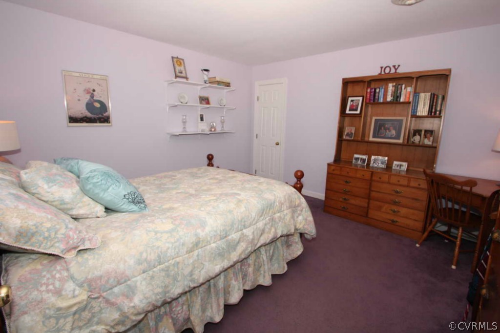 2141 Corner Rock Road Midlothian, VA 23113 - Photo 19 of 22 a bedroom with bed and book shelf