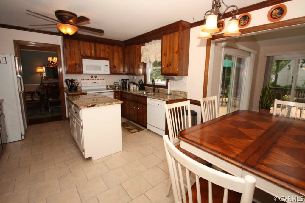 2141 Corner Rock Road Midlothian, VA 23113 - Photo 5 of 22 a kitchen that has a lot of cabinets a sink and a stove in it
