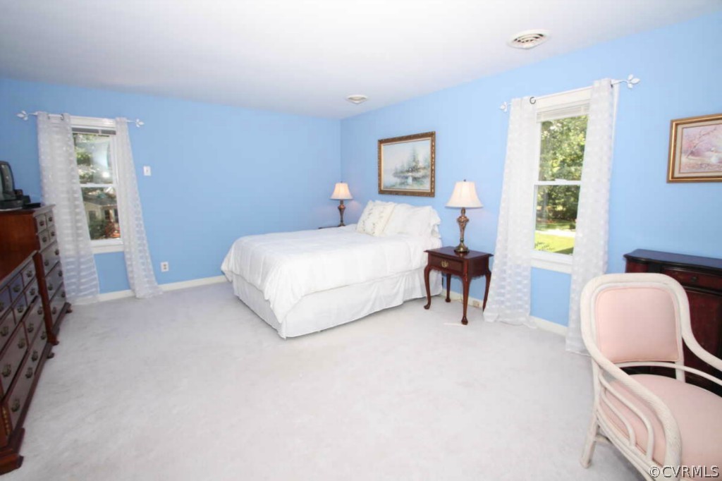 2141 Corner Rock Road Midlothian, VA 23113 - Photo 8 of 22 a bedroom with a bed and a chair