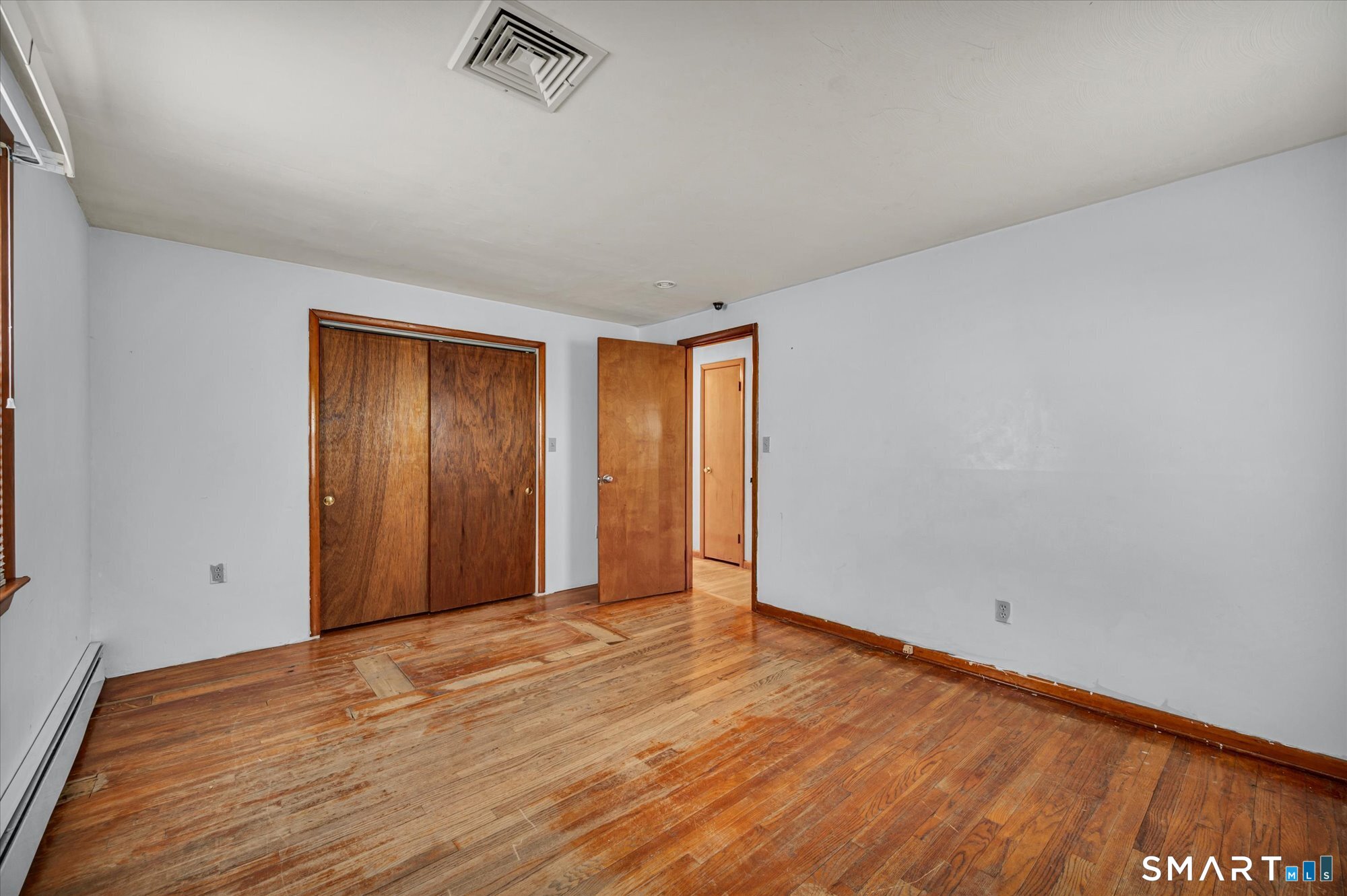 740 Rainbow Road Windsor, CT 06095 - Photo 28 of 40 an empty room with wooden floor and windows