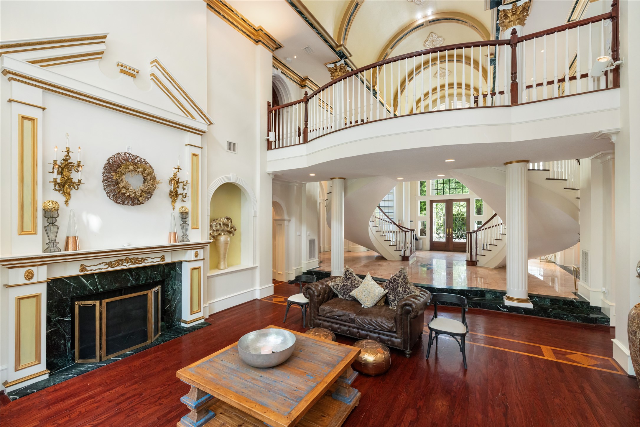 205 Grogans Point Road The Woodlands, TX 77380 - Photo 13 of 49 a living room with furniture a fireplace and wooden floor