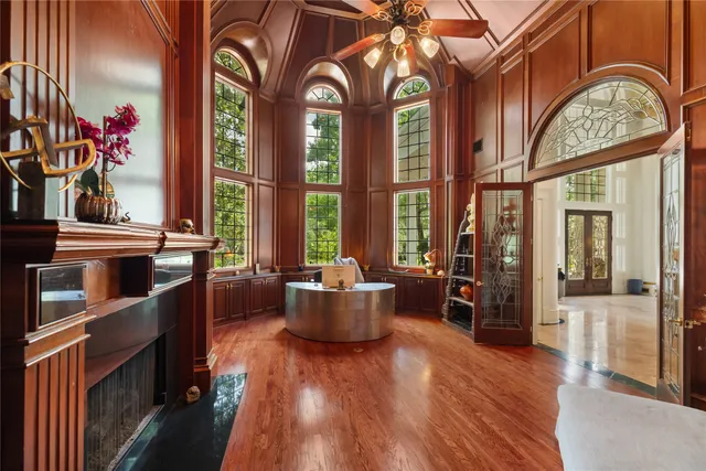 a view of living room with furniture and wooden floor