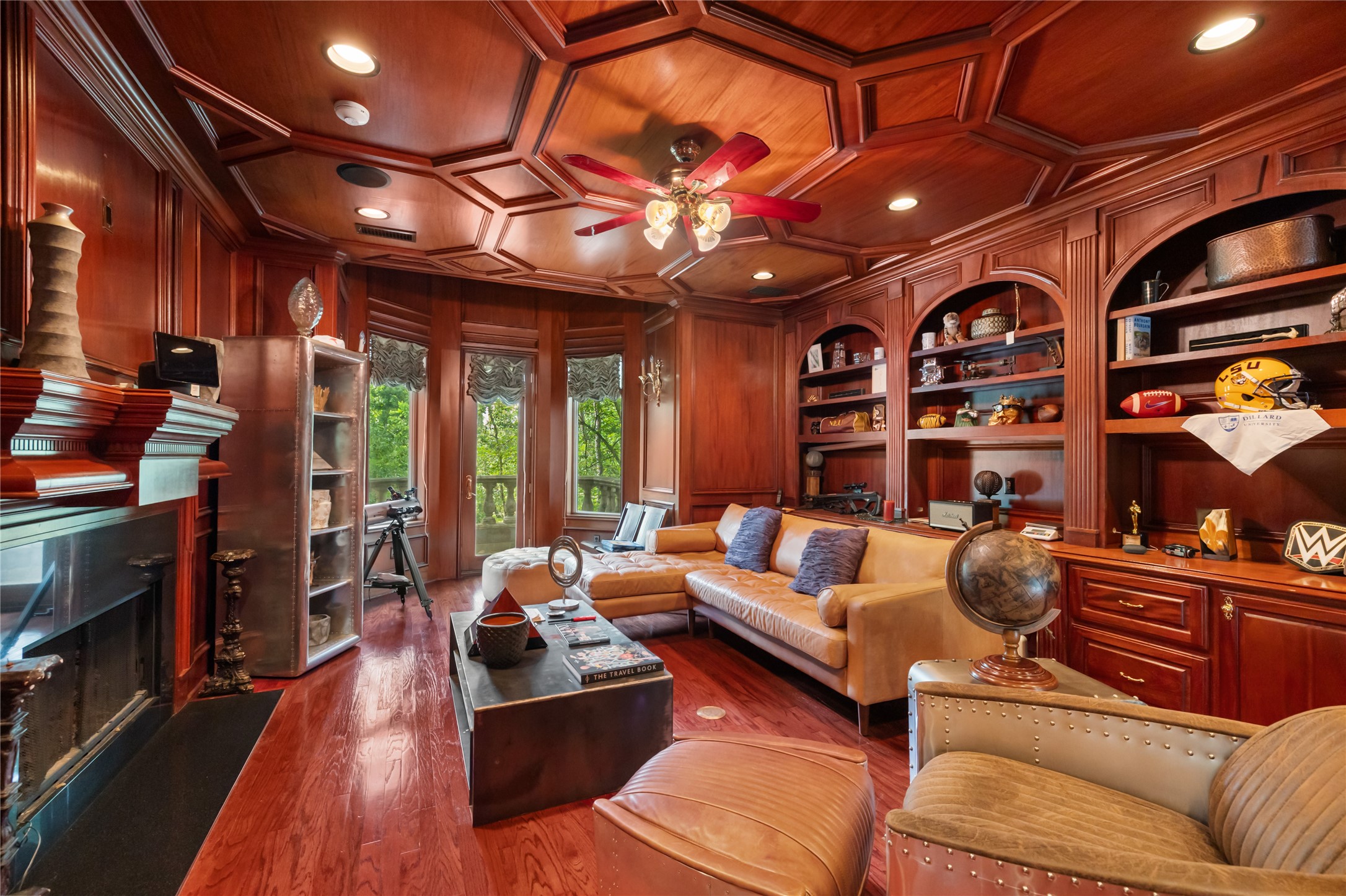 205 Grogans Point Road The Woodlands, TX 77380 - Photo 18 of 49 a living room with furniture a flat screen tv and a floor to ceiling window