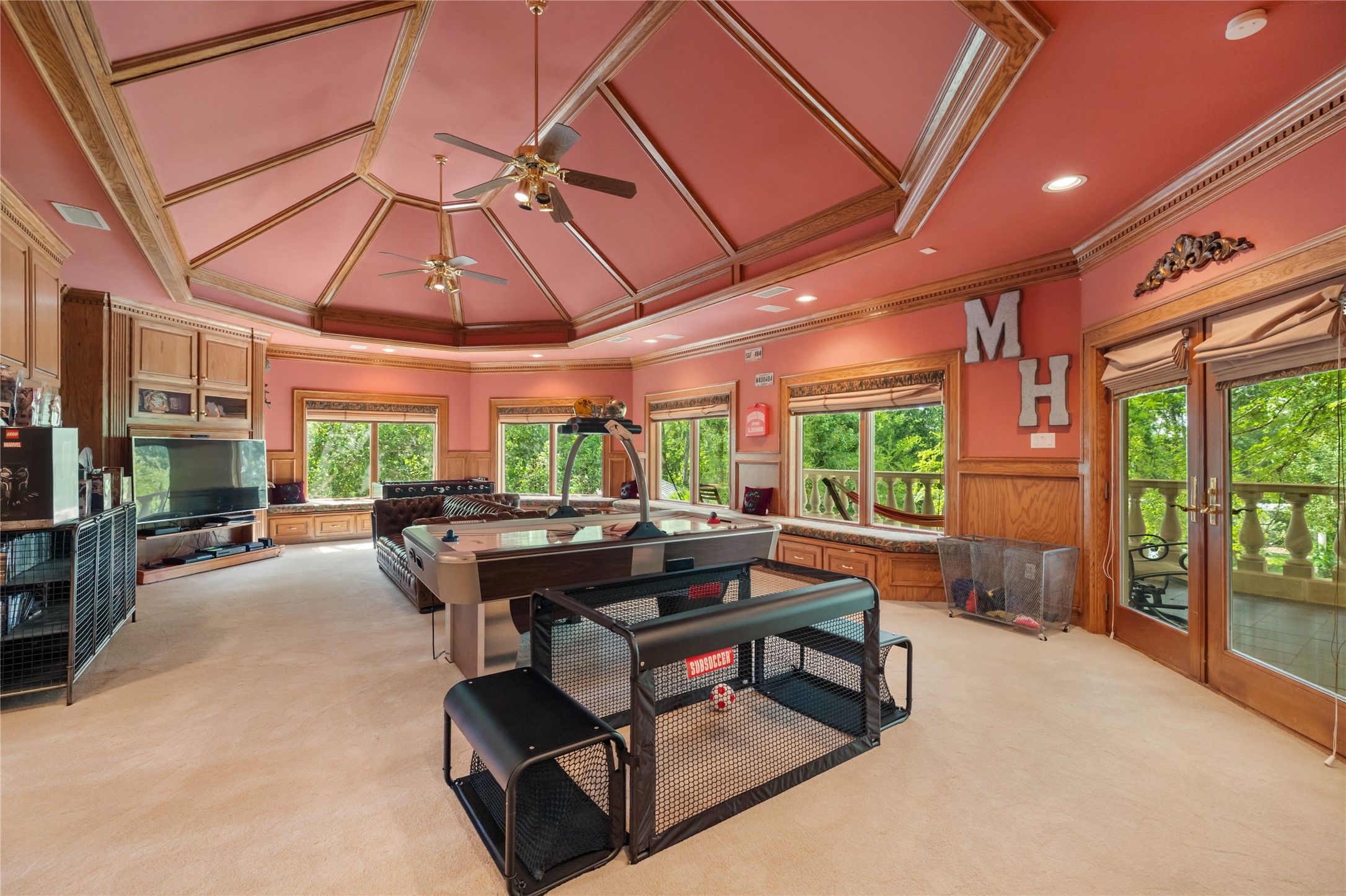 205 Grogans Point Road The Woodlands, TX 77380 - Photo 25 of 49 a room with patio furniture and a large window