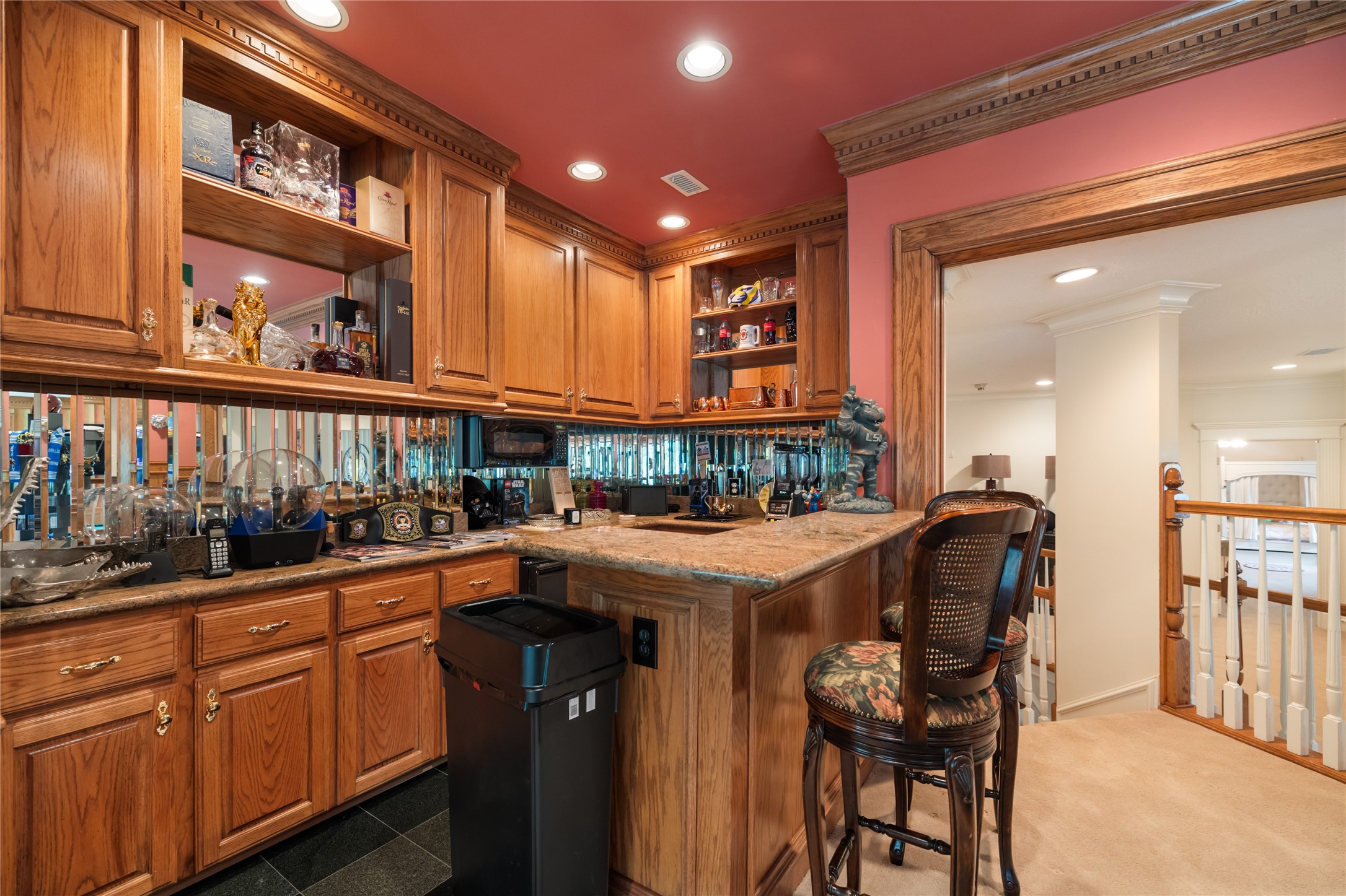205 Grogans Point Road The Woodlands, TX 77380 - Photo 26 of 49 a kitchen with stainless steel appliances granite countertop a sink and cabinets