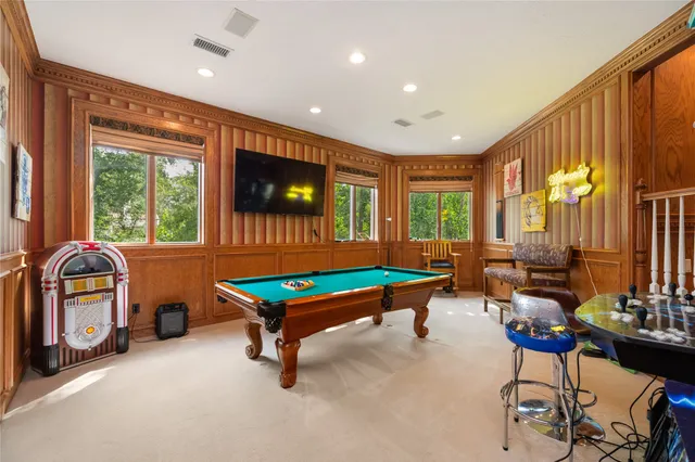 a kitchen with stainless steel appliances kitchen island granite countertop a sink and cabinets
