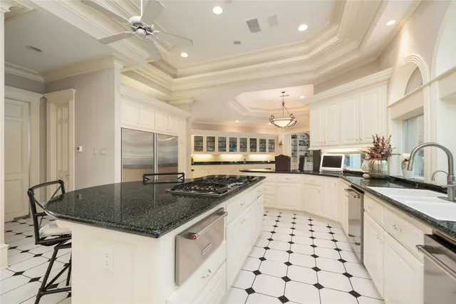 a living room with fireplace furniture and a large window