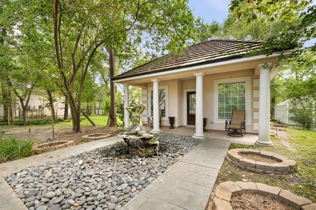 a living room with furniture and painting on the wall
