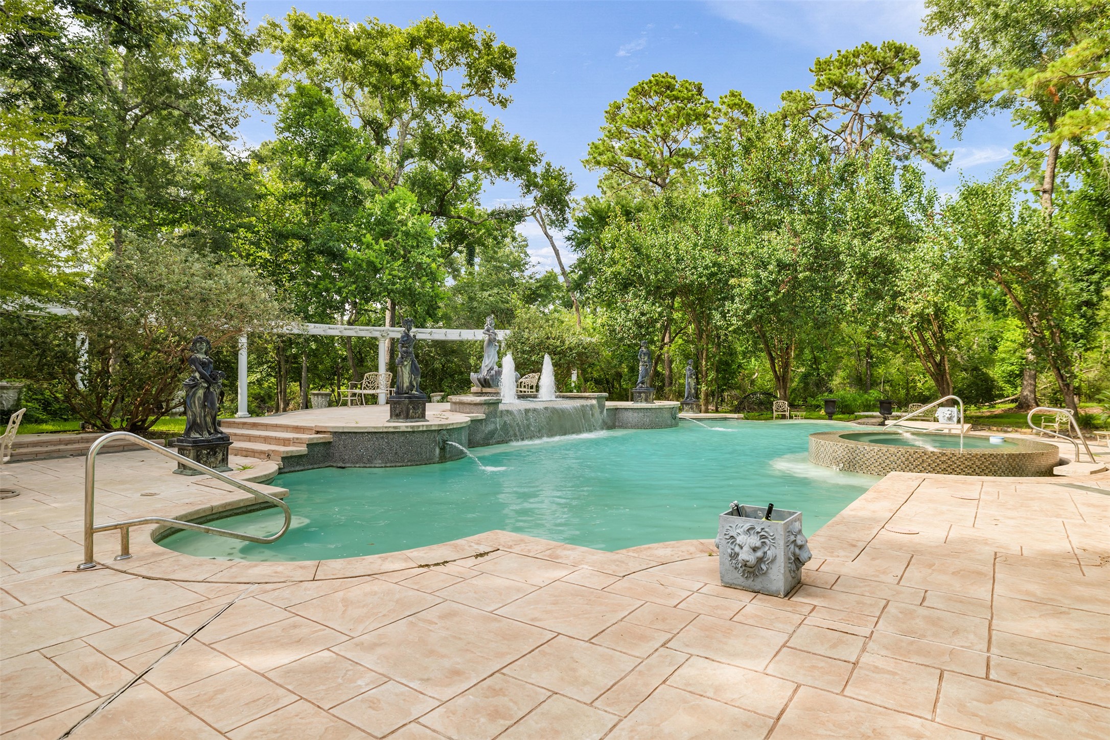 205 Grogans Point Road The Woodlands, TX 77380 - Photo 42 of 49 a view of a backyard with sitting area