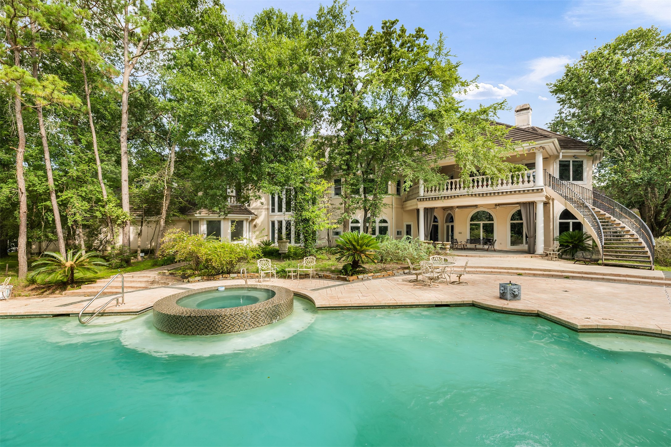 205 Grogans Point Road The Woodlands, TX 77380 - Photo 45 of 49 a view of a house with backyard and sitting area