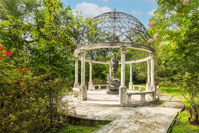 an aerial view of a house with outdoor space and street view