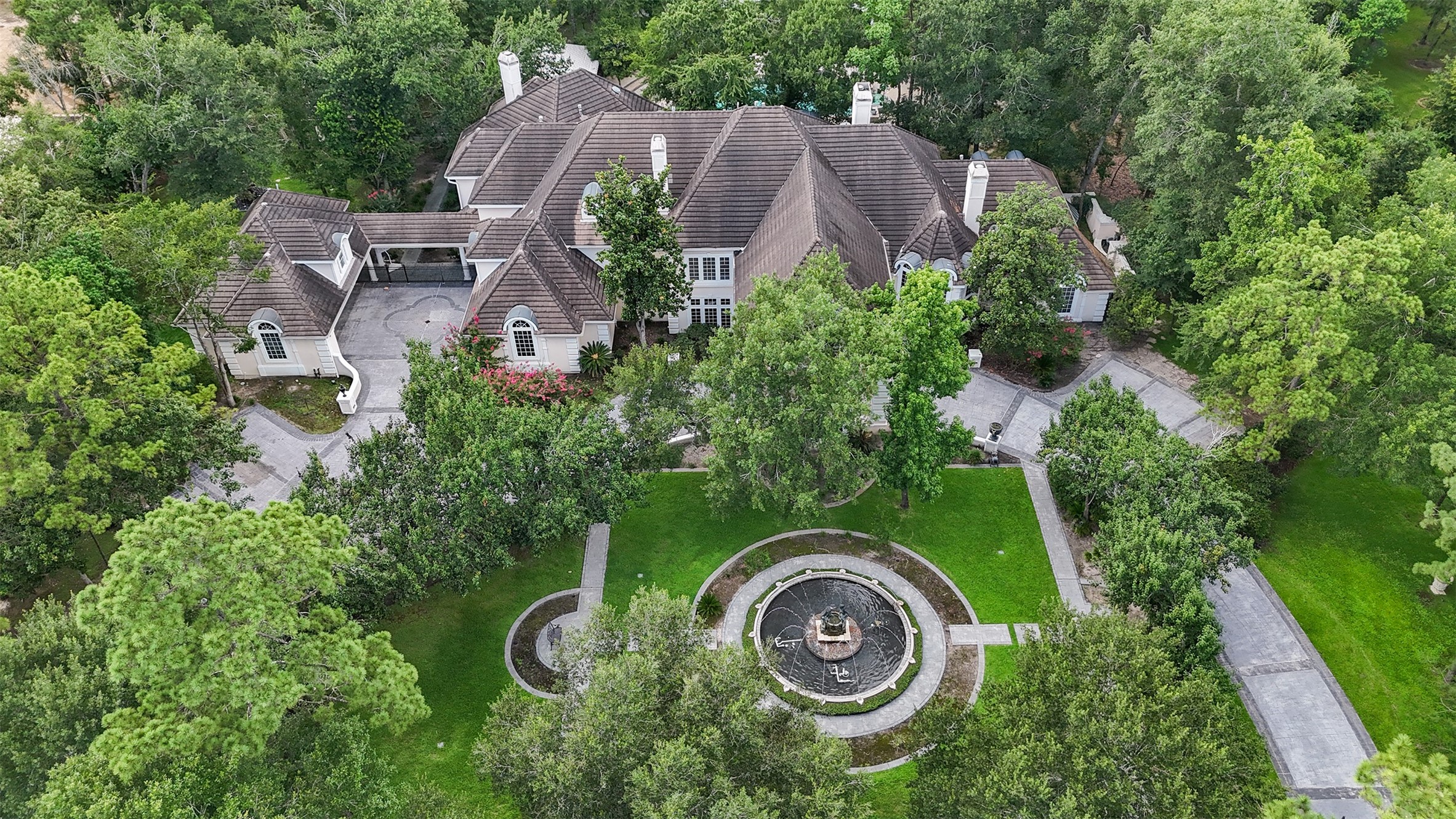 205 Grogans Point Road The Woodlands, TX 77380 - Photo 49 of 49 an aerial view of a house with outdoor space and street view
