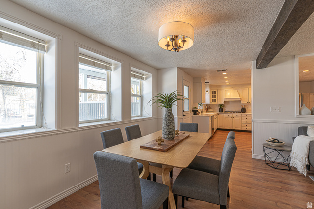 1045 Fox Farm Road Logan, UT 84321 - Photo 23 of 65 Dining space with a textured ceiling, dark wood-style flooring, beam ceiling, and recessed lighting