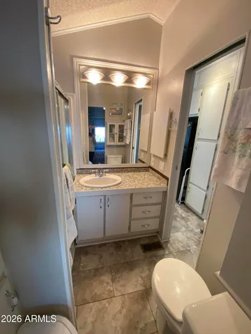 a bathroom with a sink and mirror
