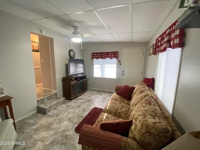 a living room with furniture and a window