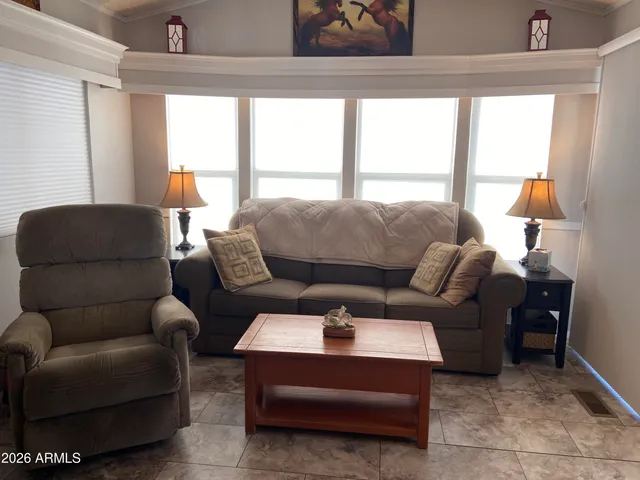 a living room with furniture and a window