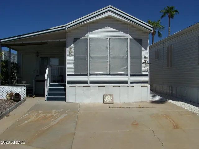 a view of a patio with table and chairs potted plants with barbeque grill