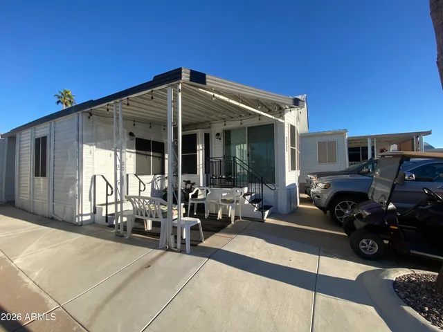a view of a car park in front of house