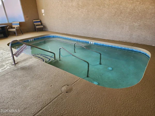 a view of a swimming pool with a balcony