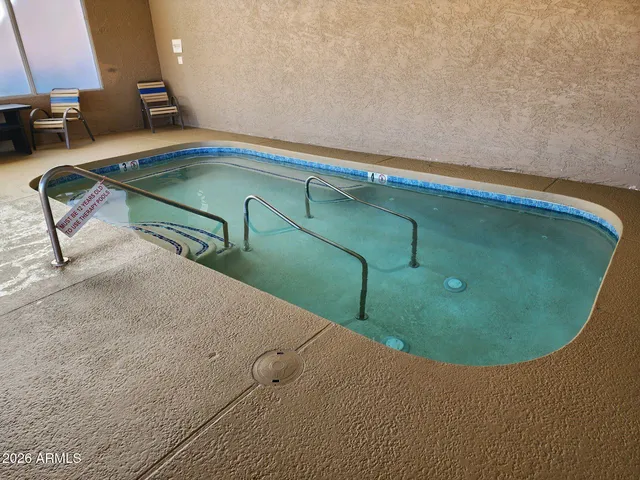 a view of a swimming pool with a balcony